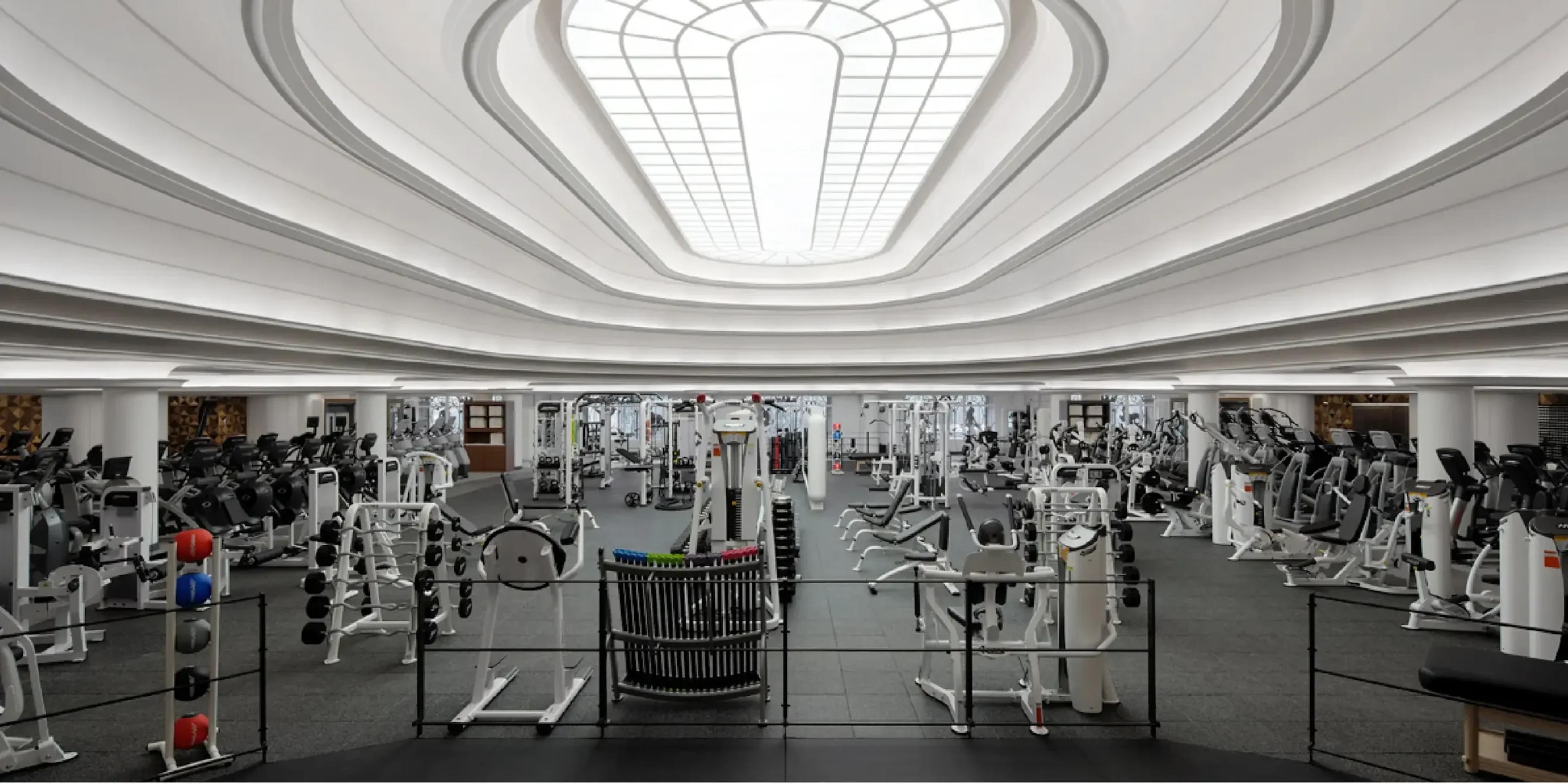 interior of a gym with a skylight and white ceiling