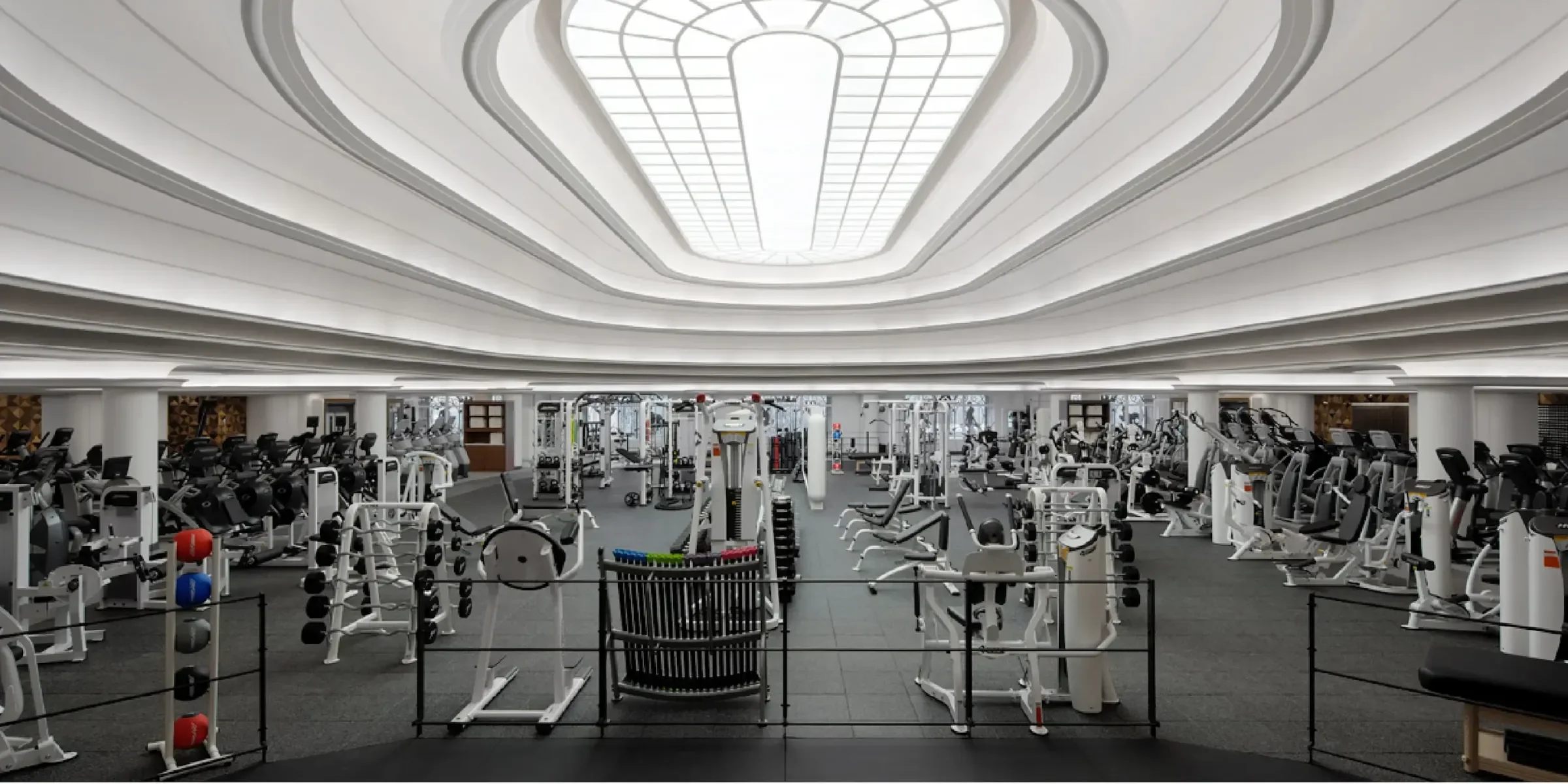 interior of a gym with a skylight and white ceiling