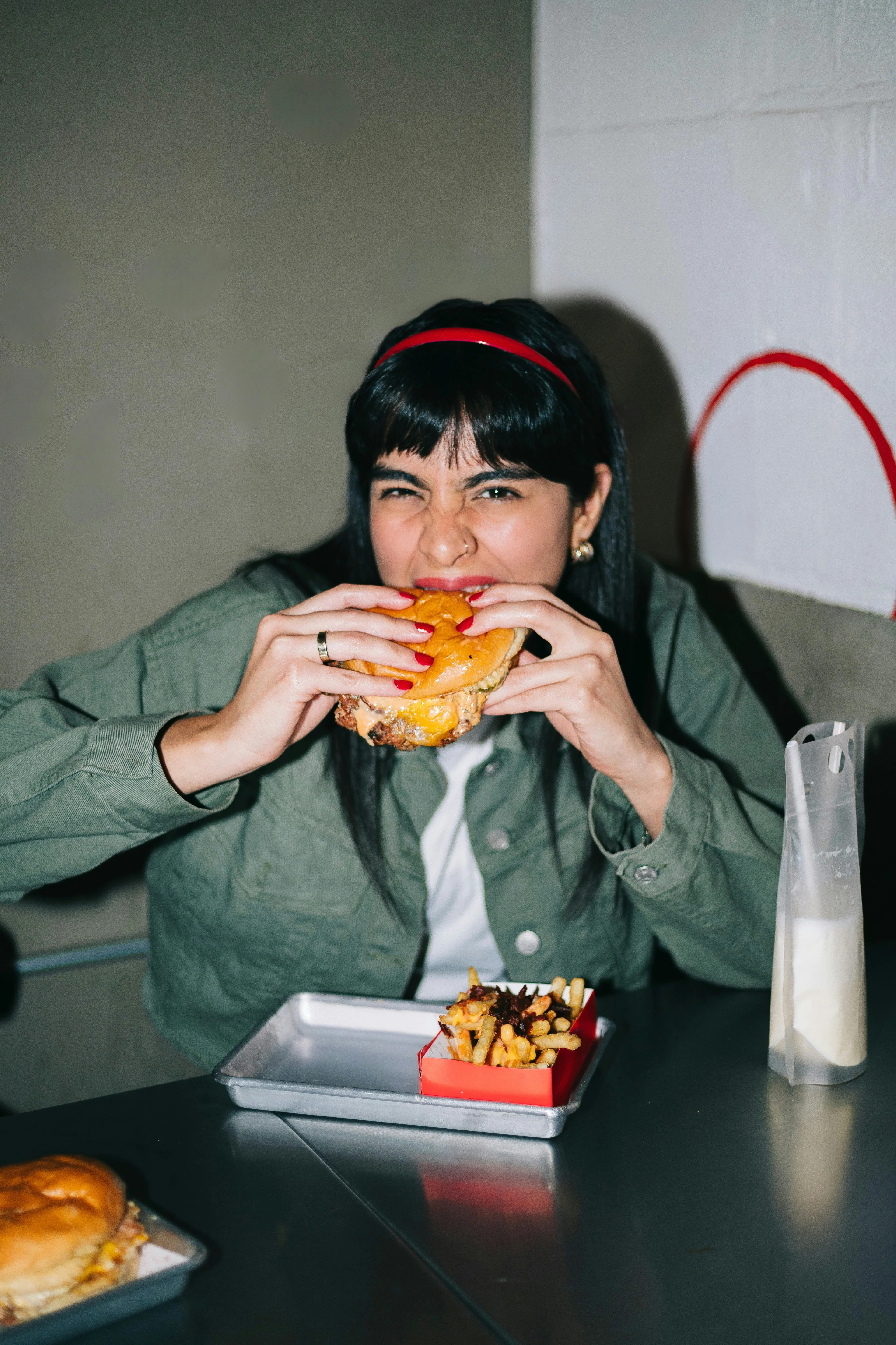 girl biting into a burger