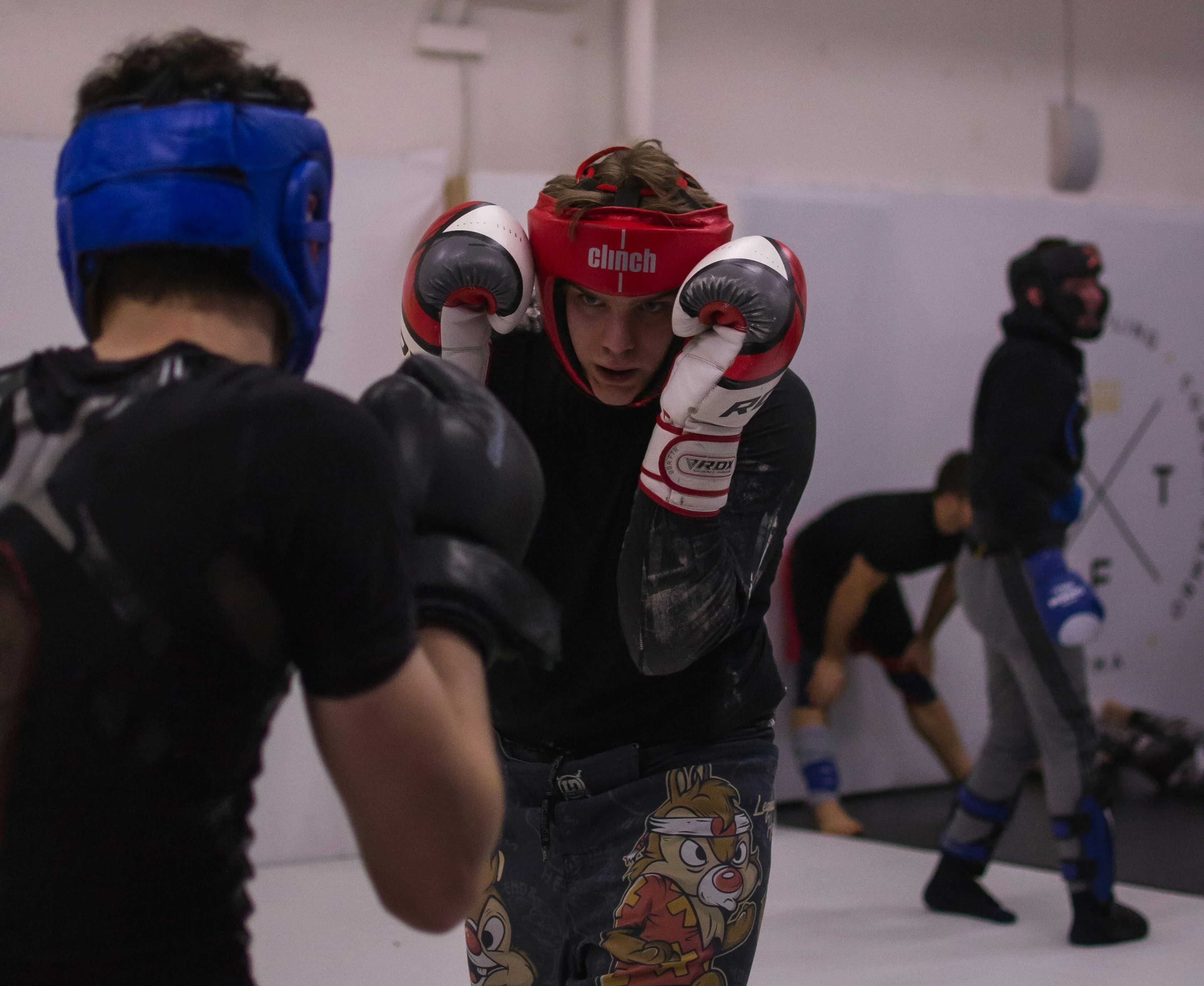 two people practicing MMA