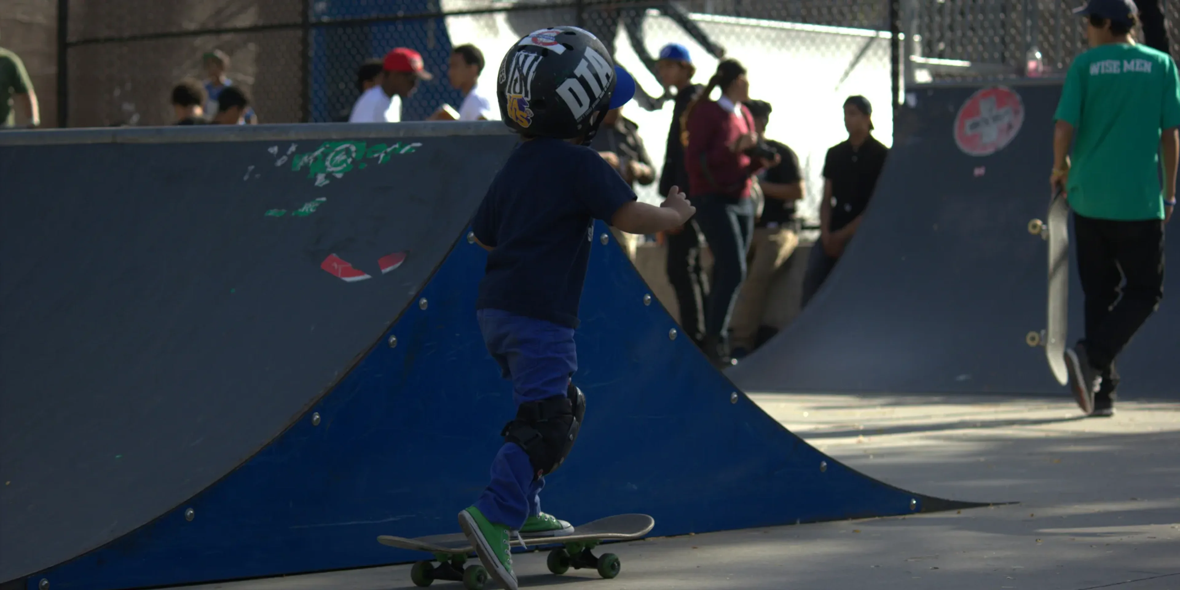 A man riding a skateboard on top of a ramp