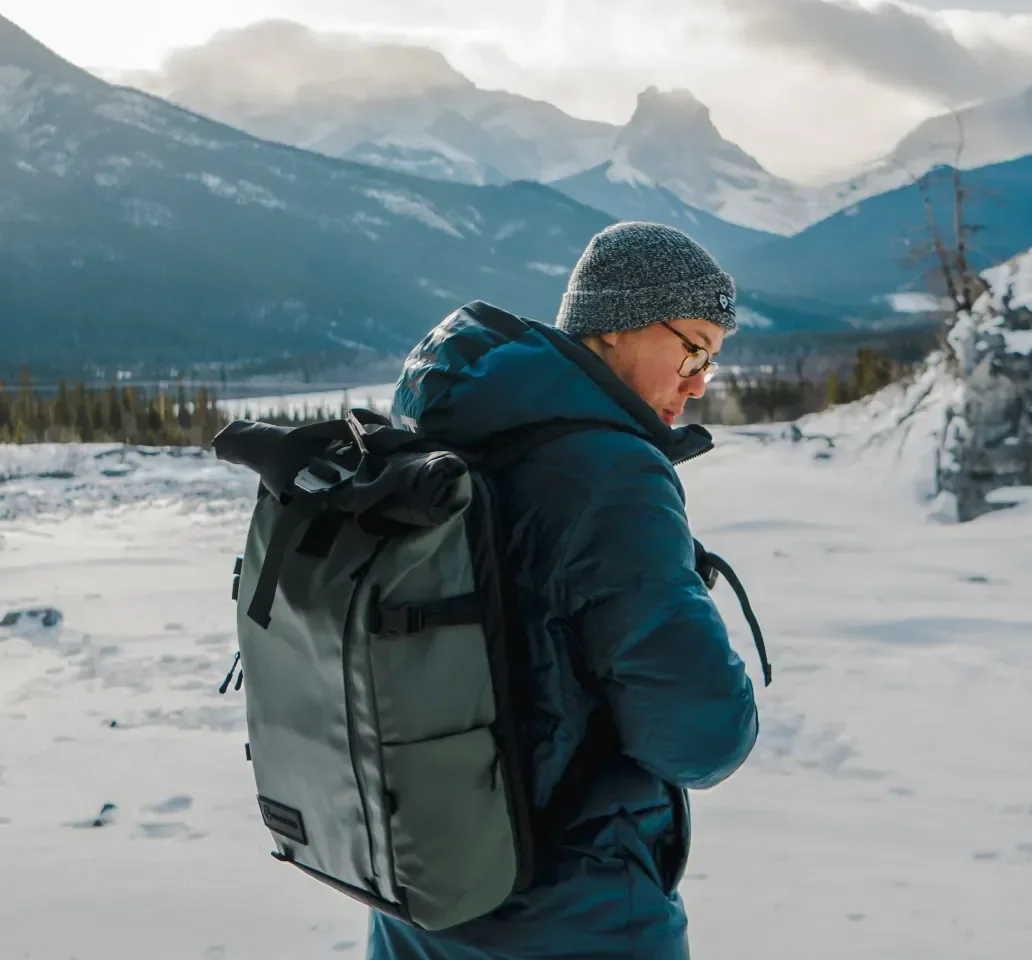 Hiking imagery featuring Fieldsmith Roll-Top Pack