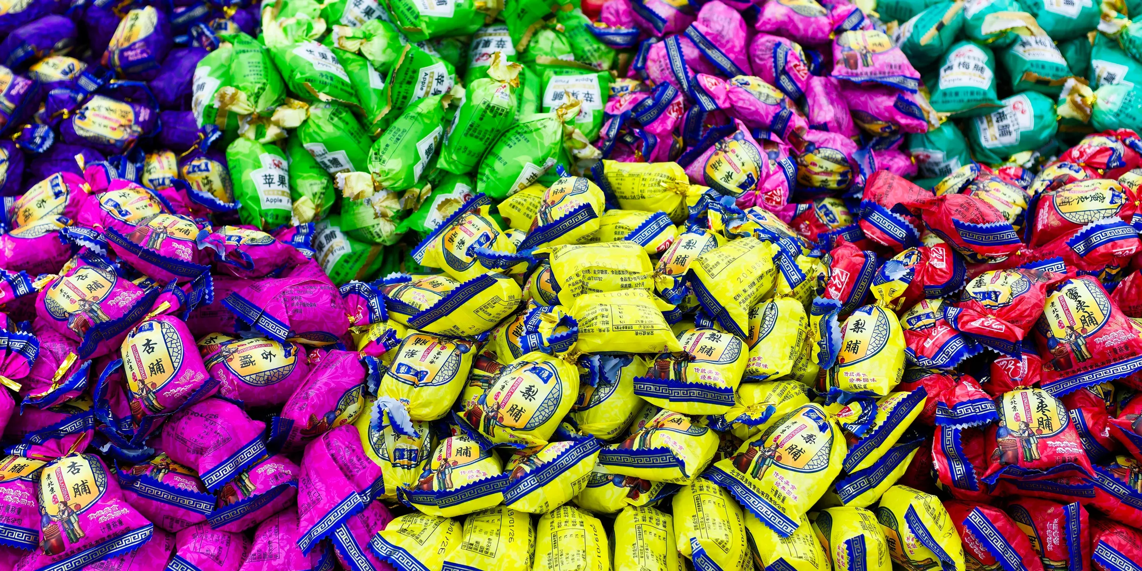 A large pile of colorful candies sitting on top of a table