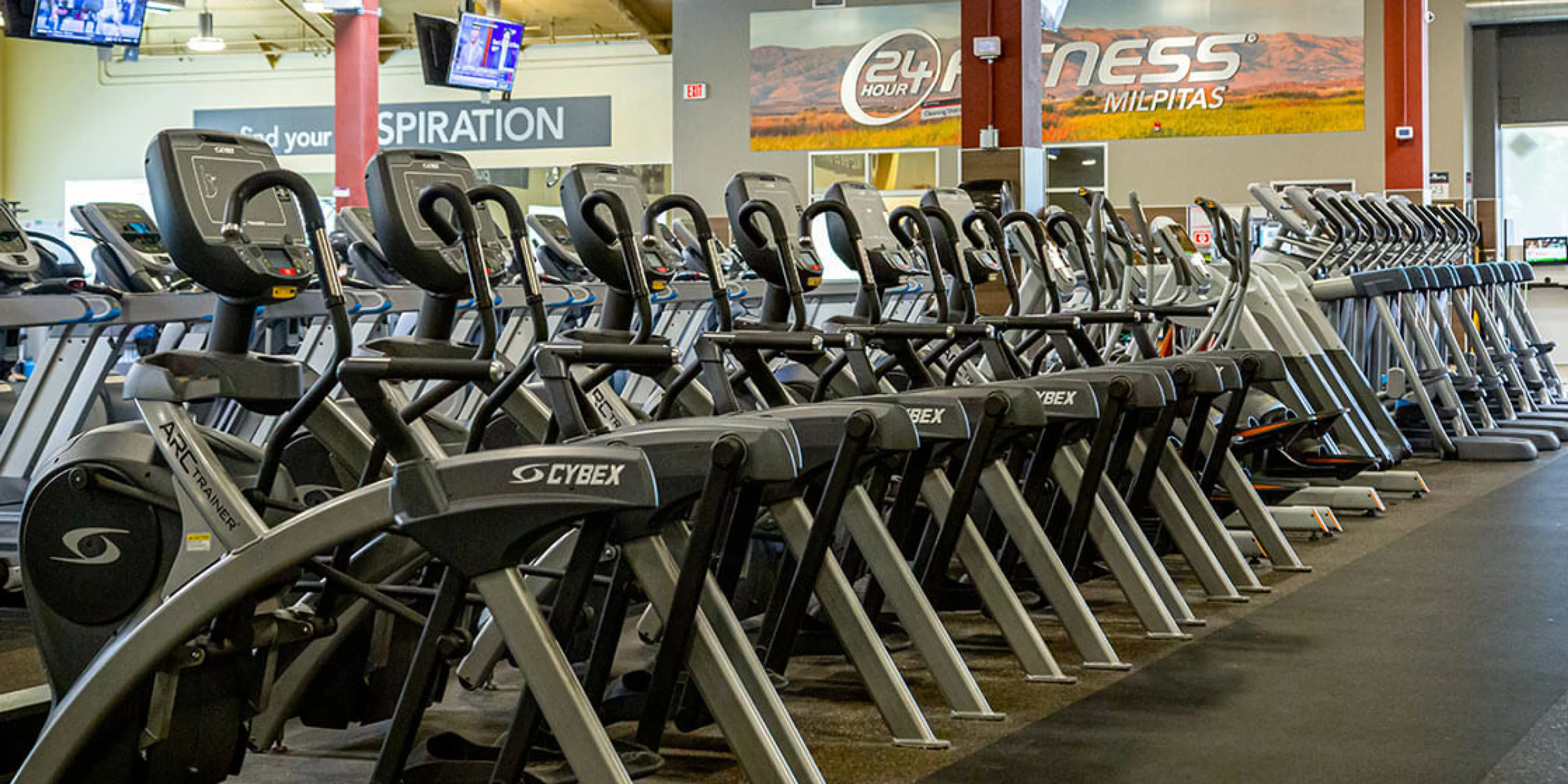 gym interior showing ellipticals and treadmills