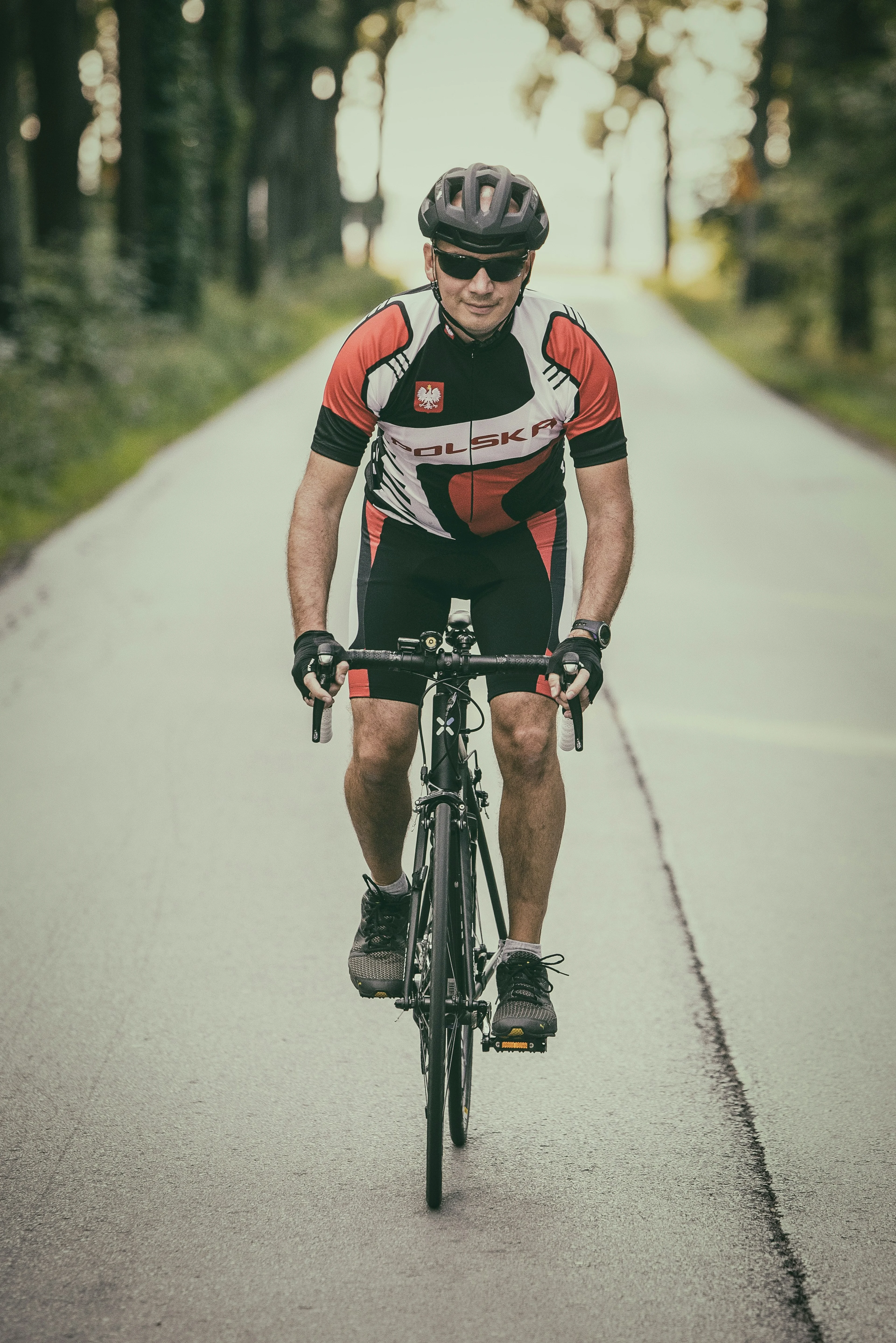 person cycling with Garmin watch