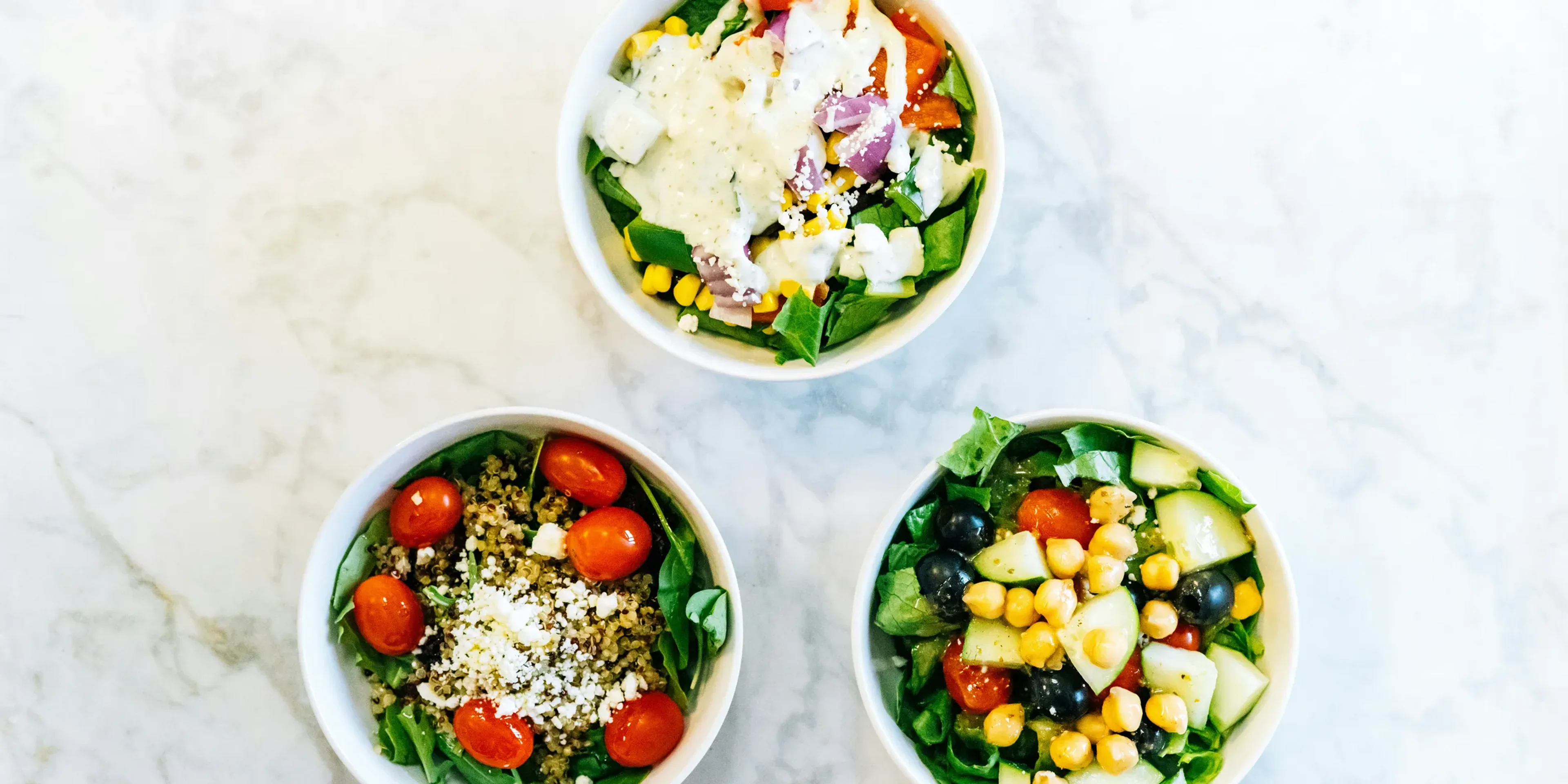 Three delicious and healthy salad bowls.