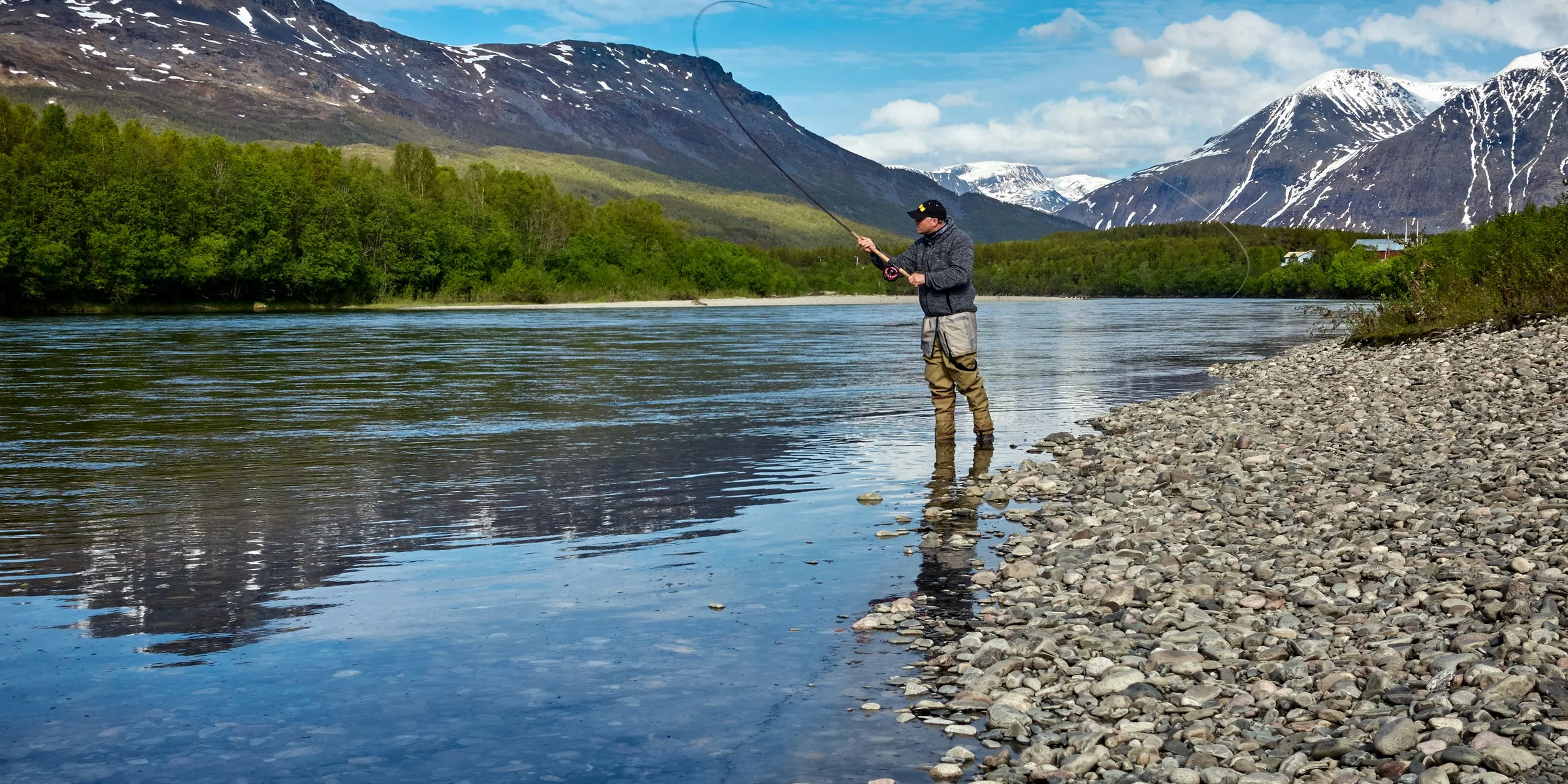 man fishing on the river