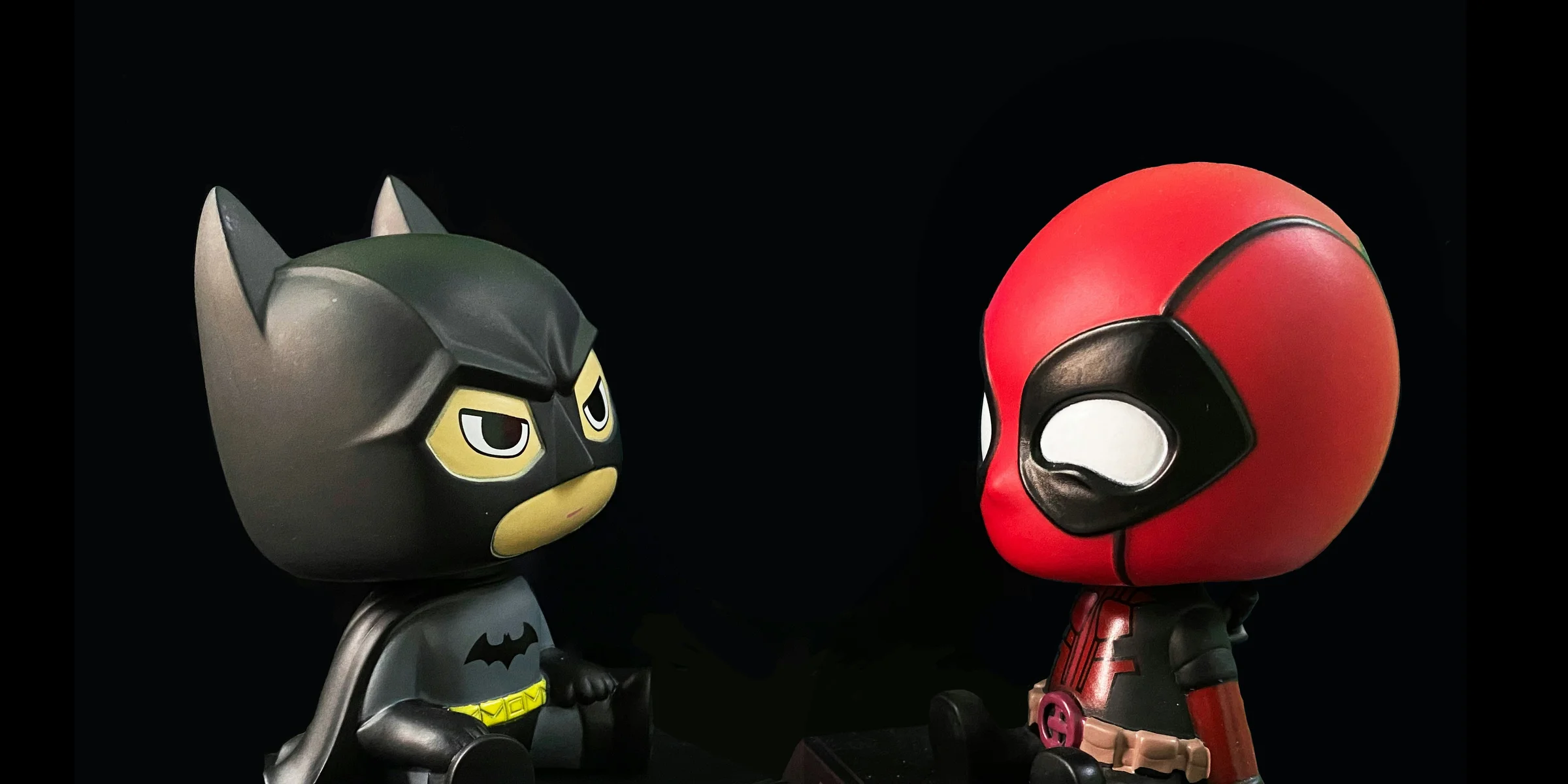 red and black batman action figure.