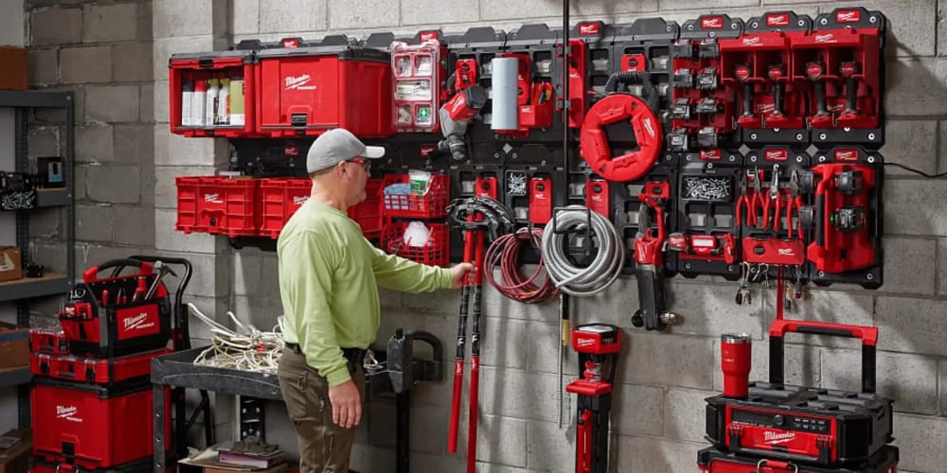 person in front of a wall of tools