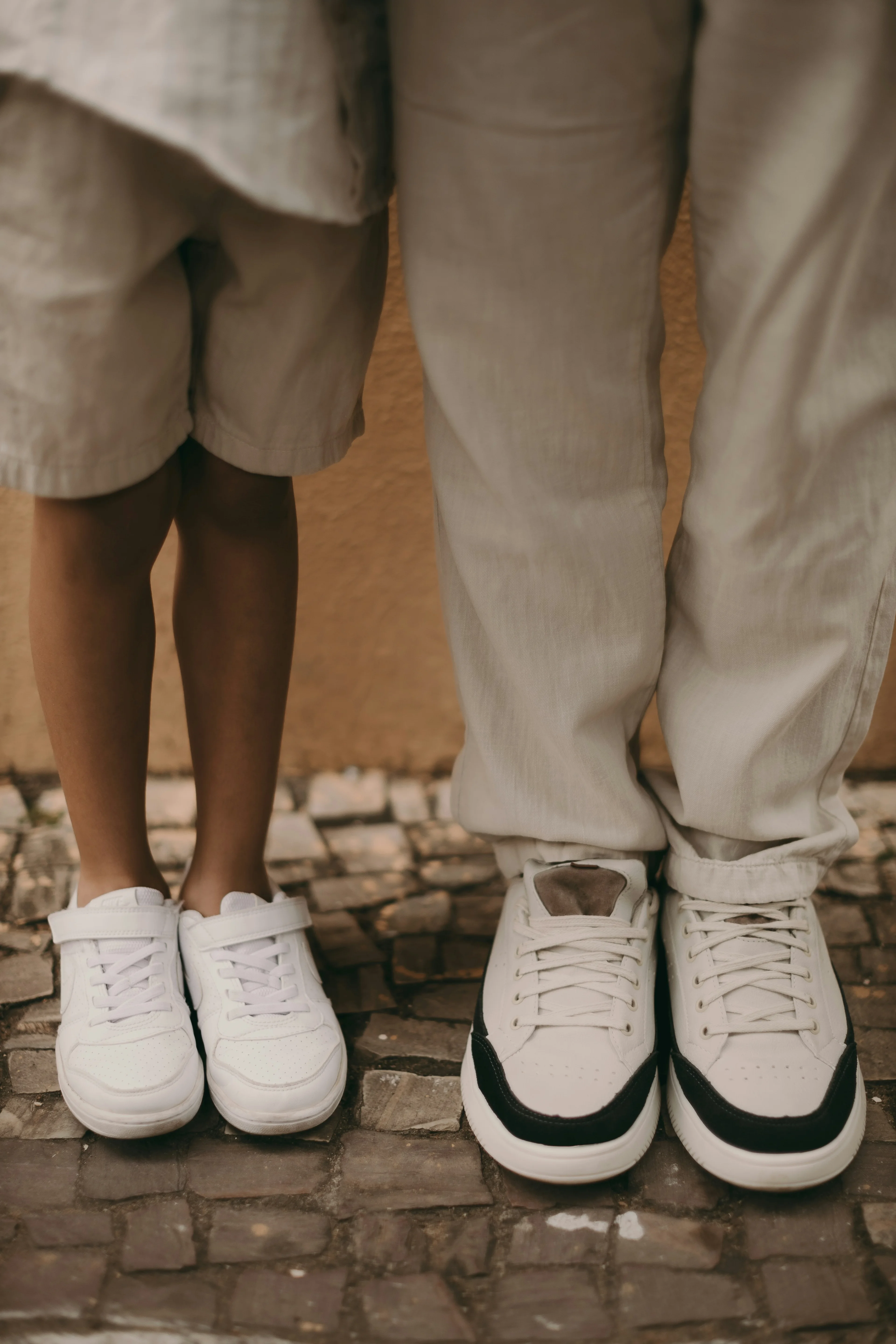 two people's legs with shoes