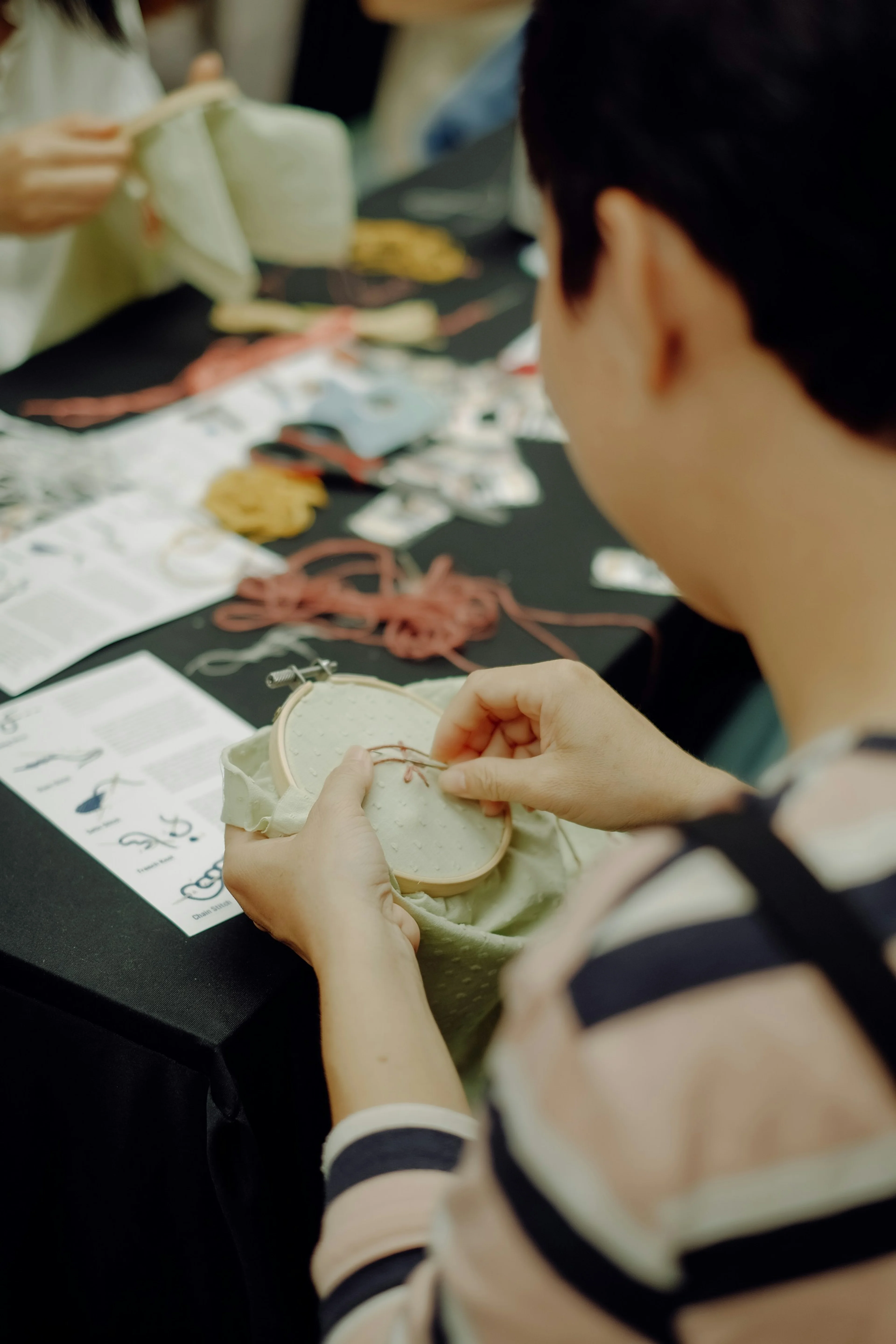 woman sewing at a table