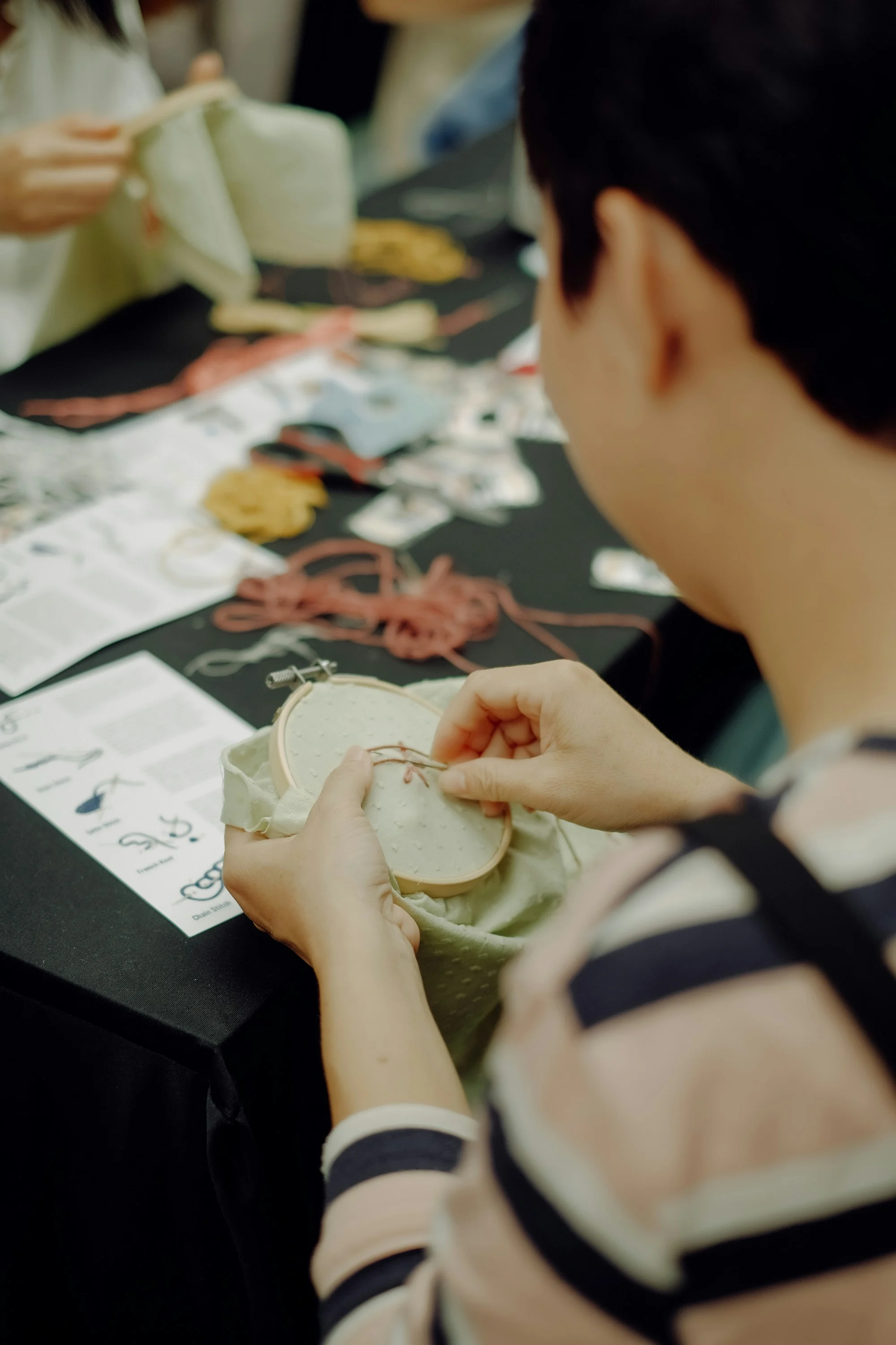 woman sewing at a table