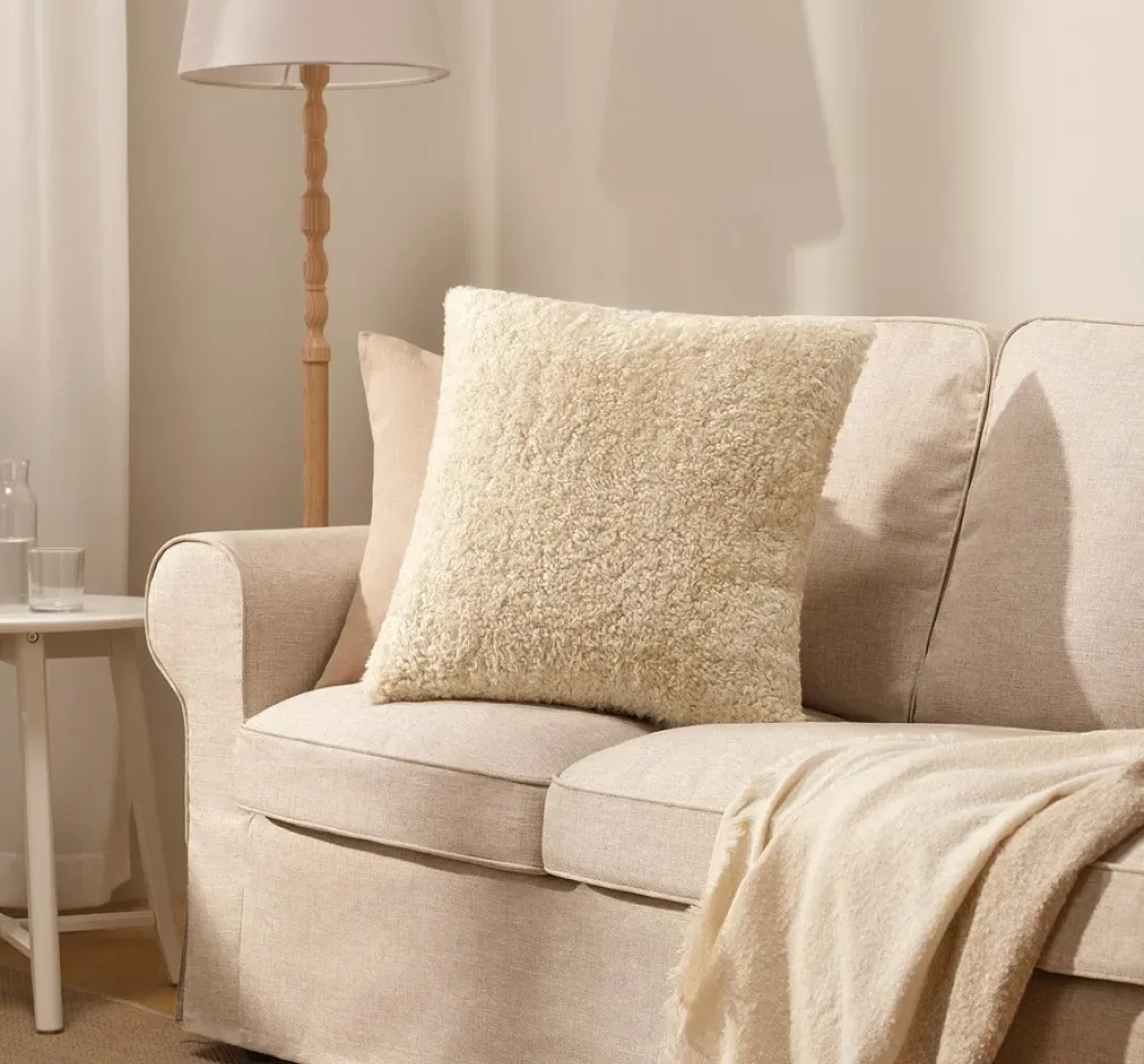 Home essentials imagery featuring ÅSJORDFLY cushion cover