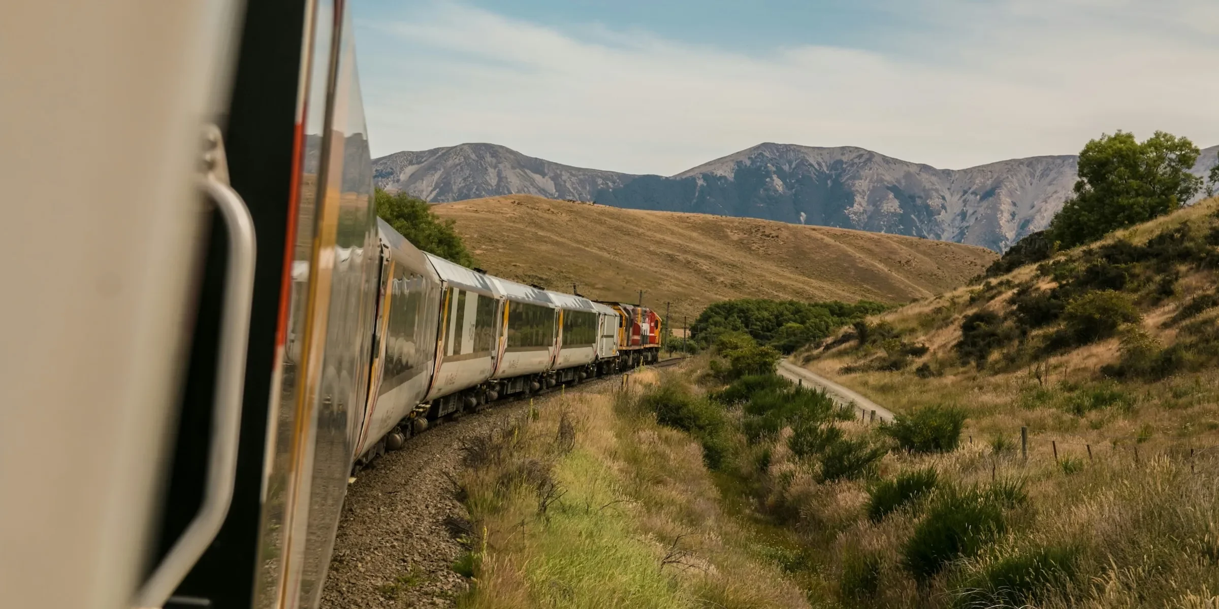 train driving on rails in a field