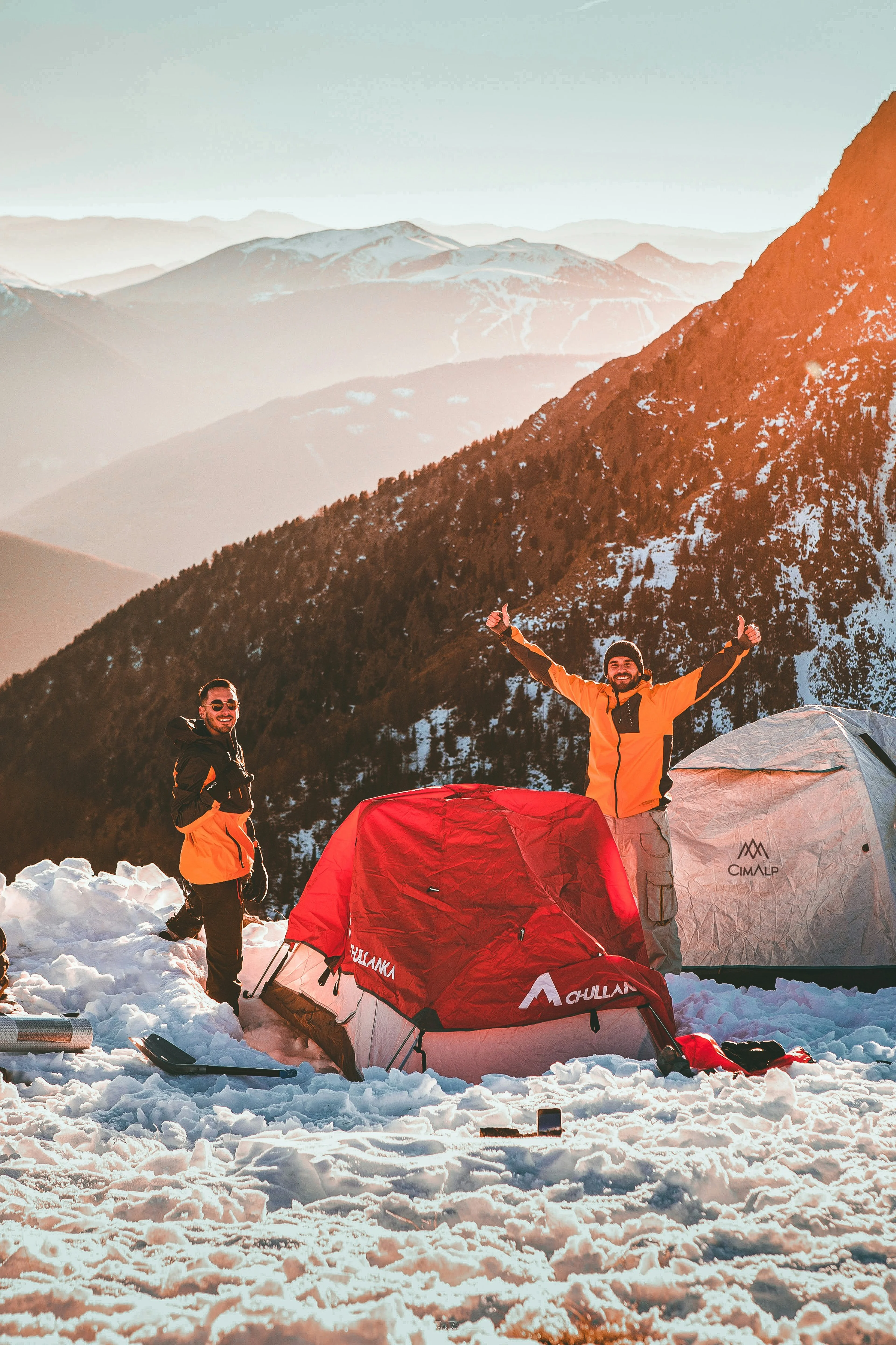 happy people camping in the winter