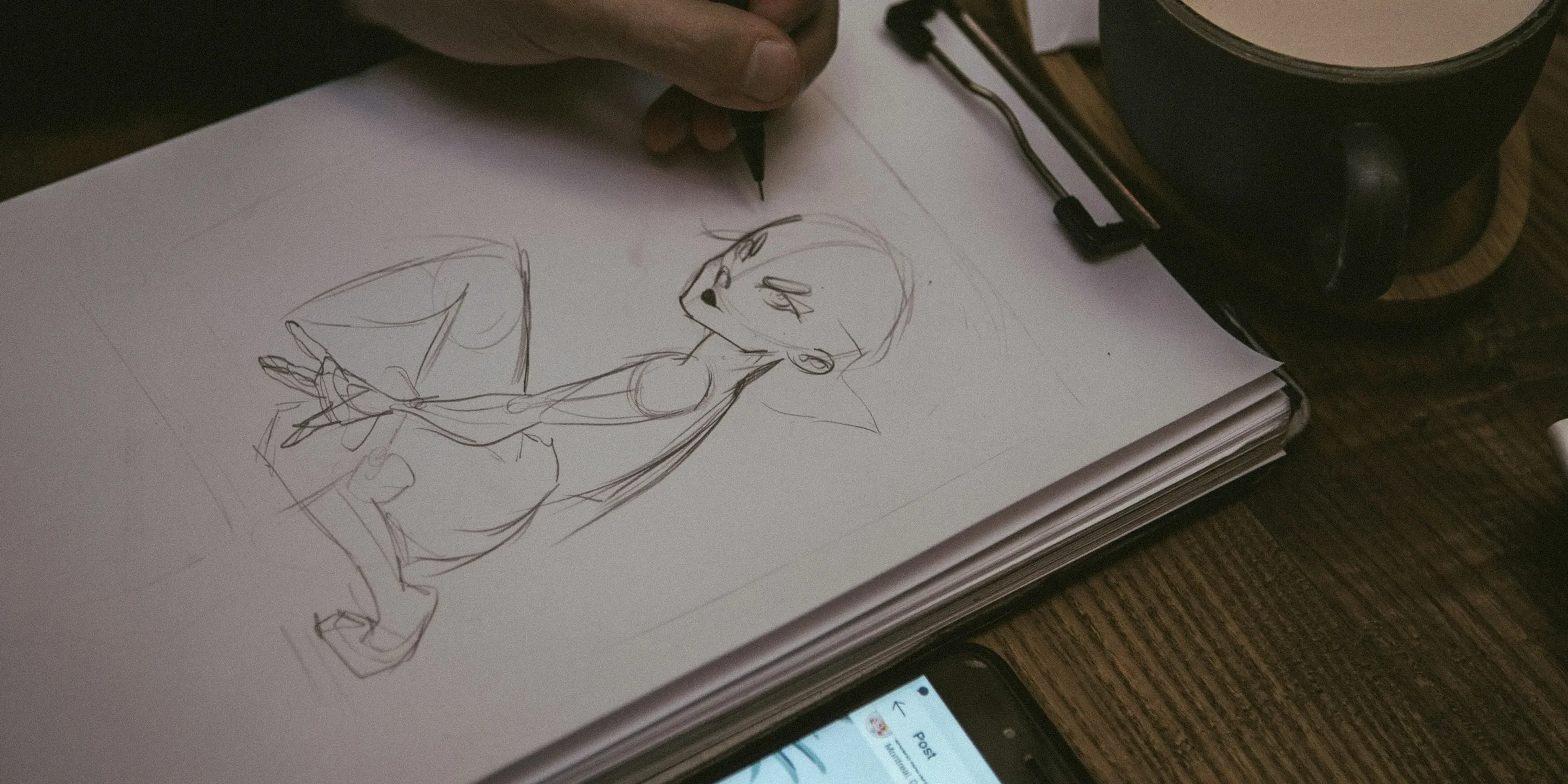 man drawing portrait of man
