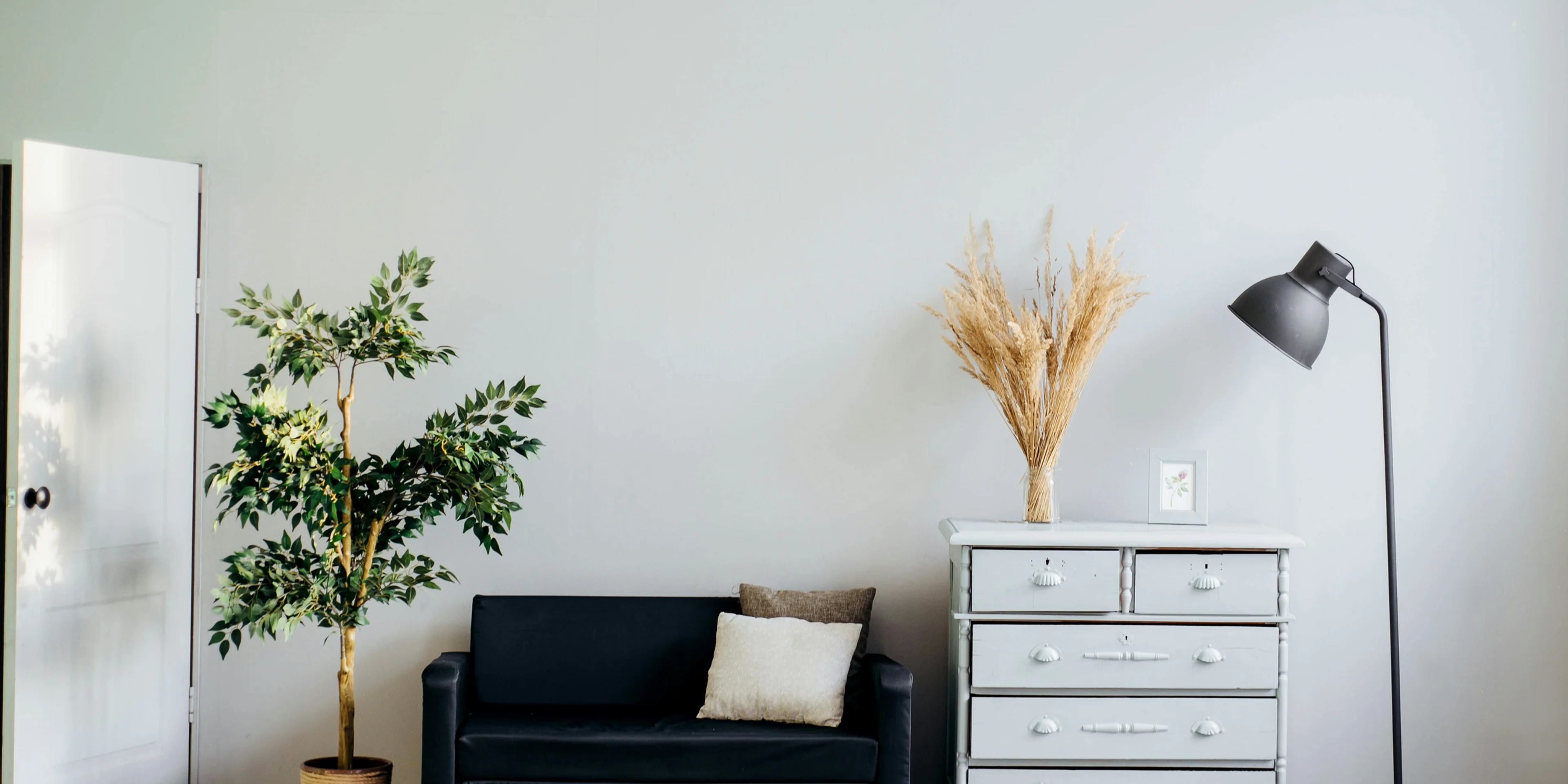 dresser beside sofa.