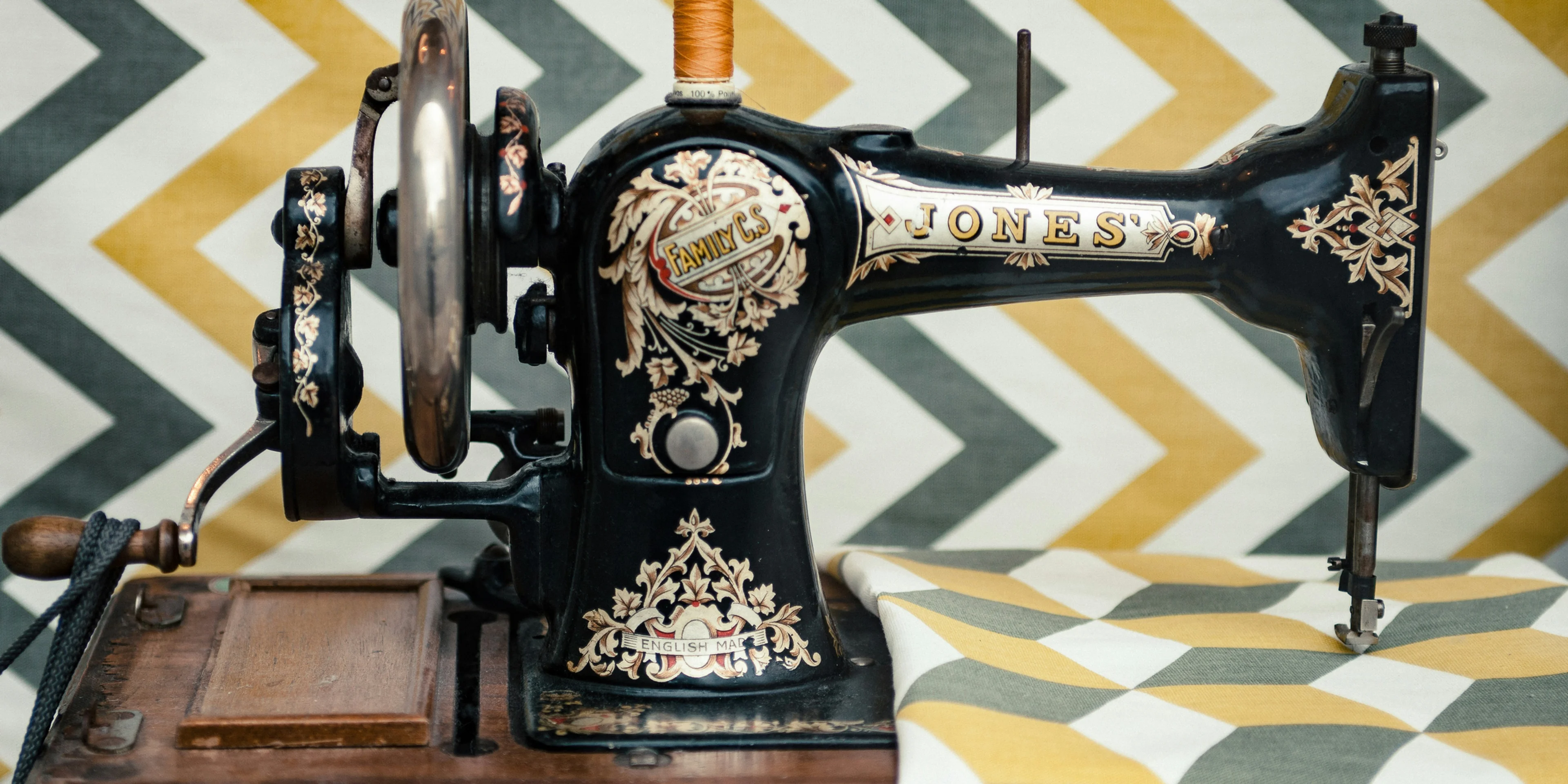 white and yellow chevron cloth on black sewing machine.
