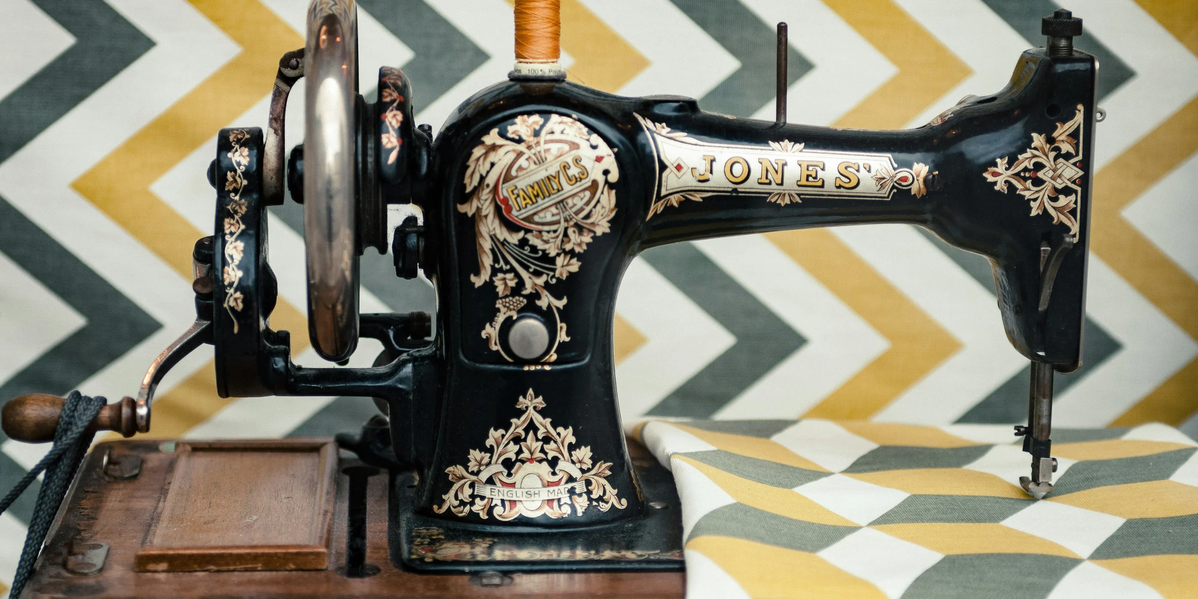 white and yellow chevron cloth on black sewing machine.
