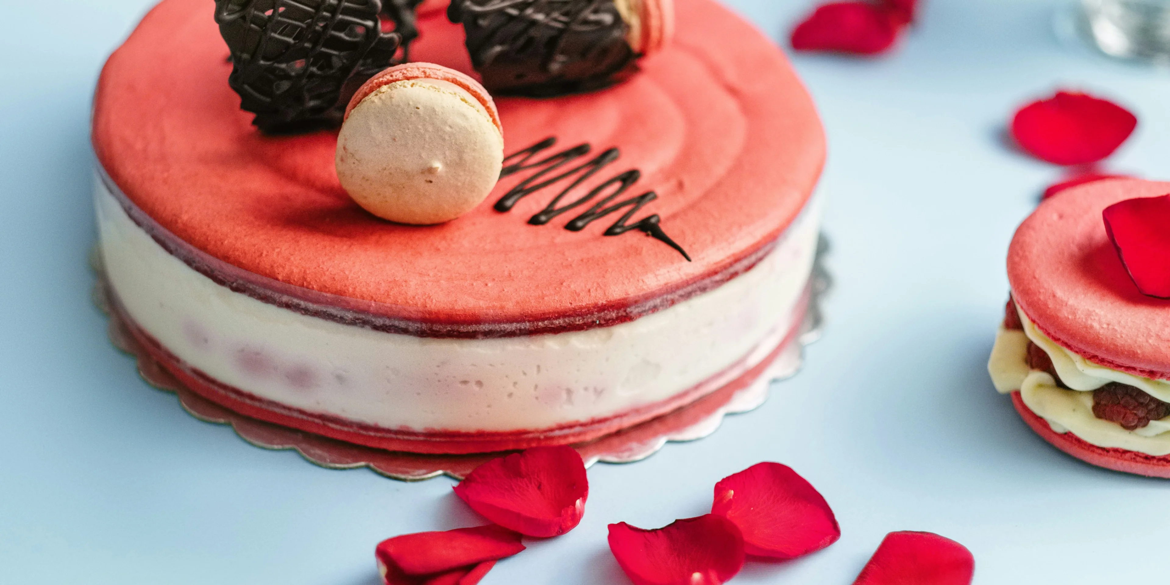 round red and white cake with cookies toppings.