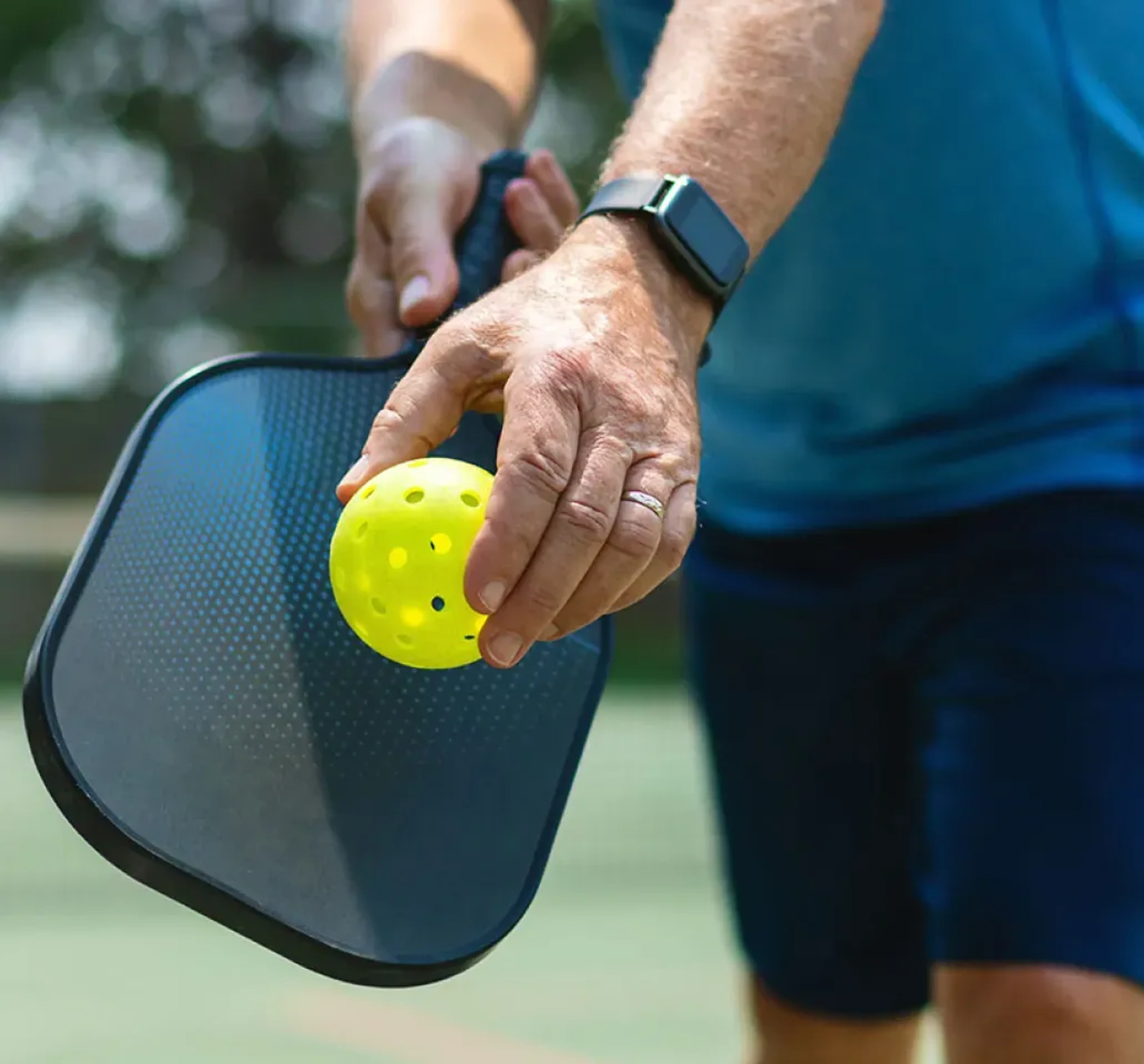 Pickleball imagery featuring Wilson Tru Outdoor Pickleballs