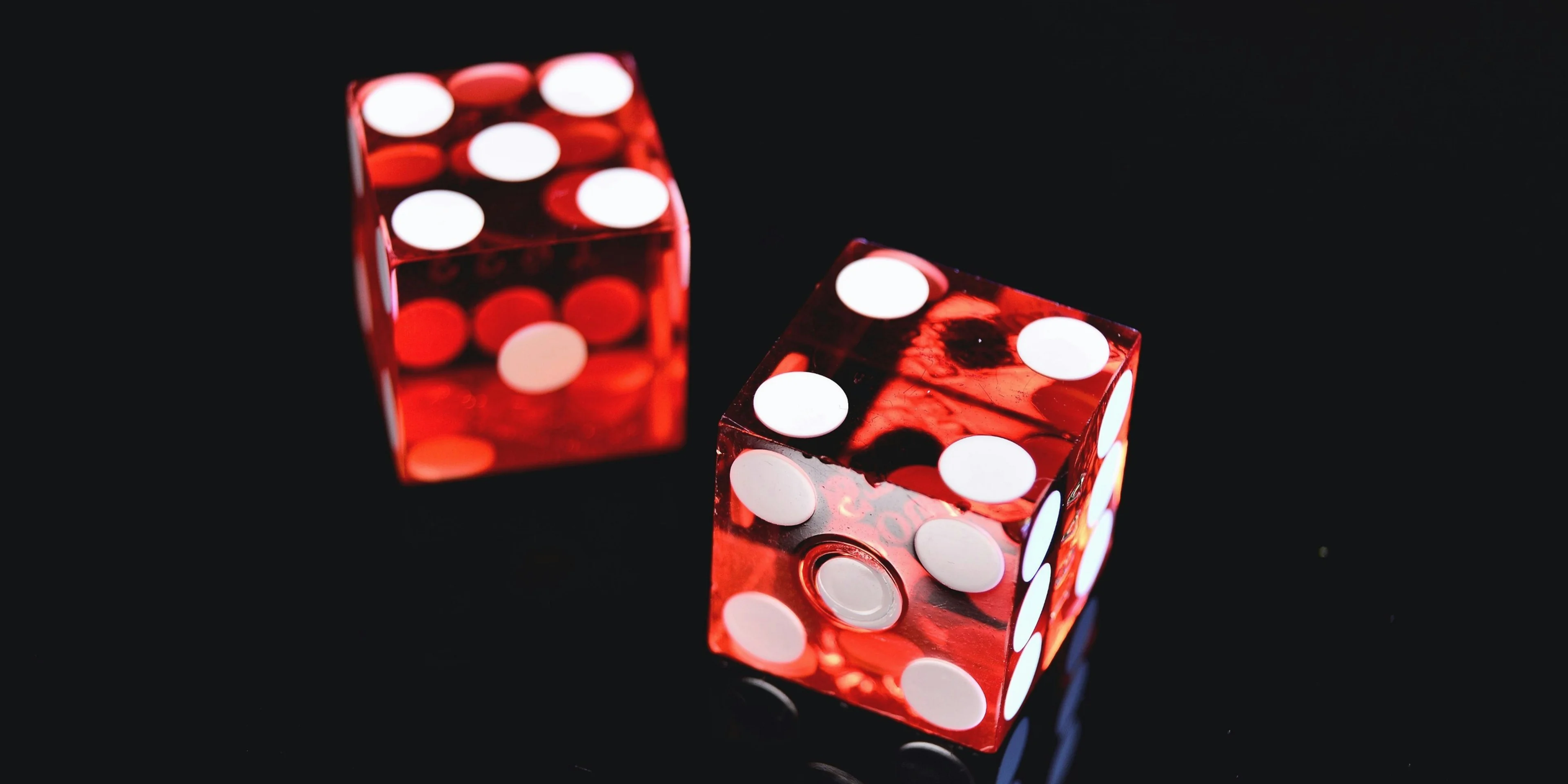 two red-and-white dices.