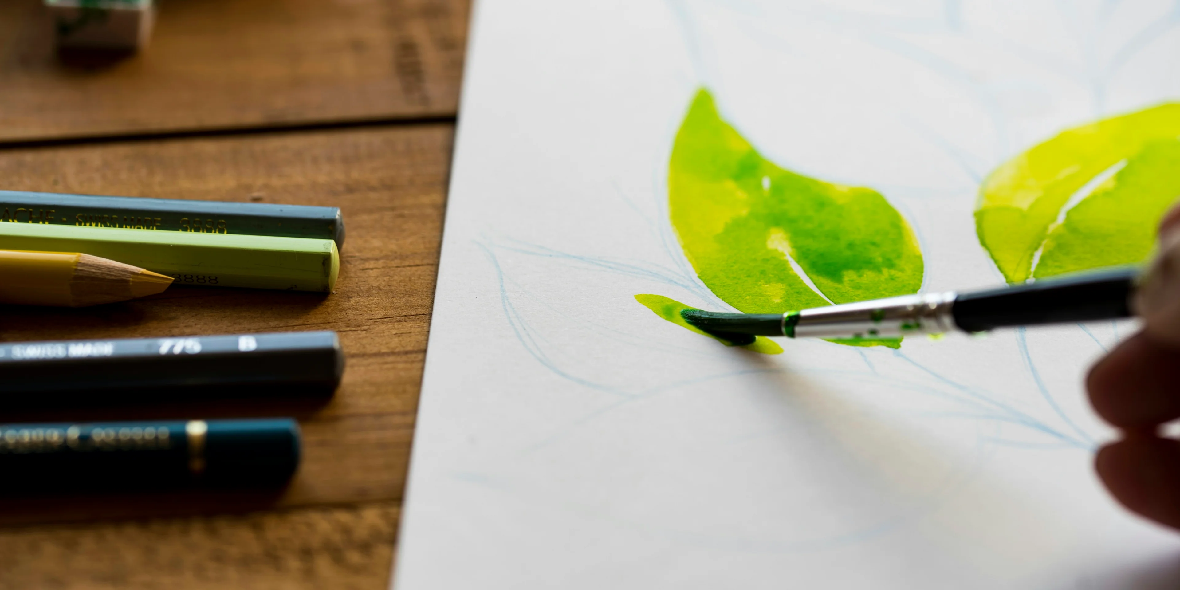 person painting leaves.