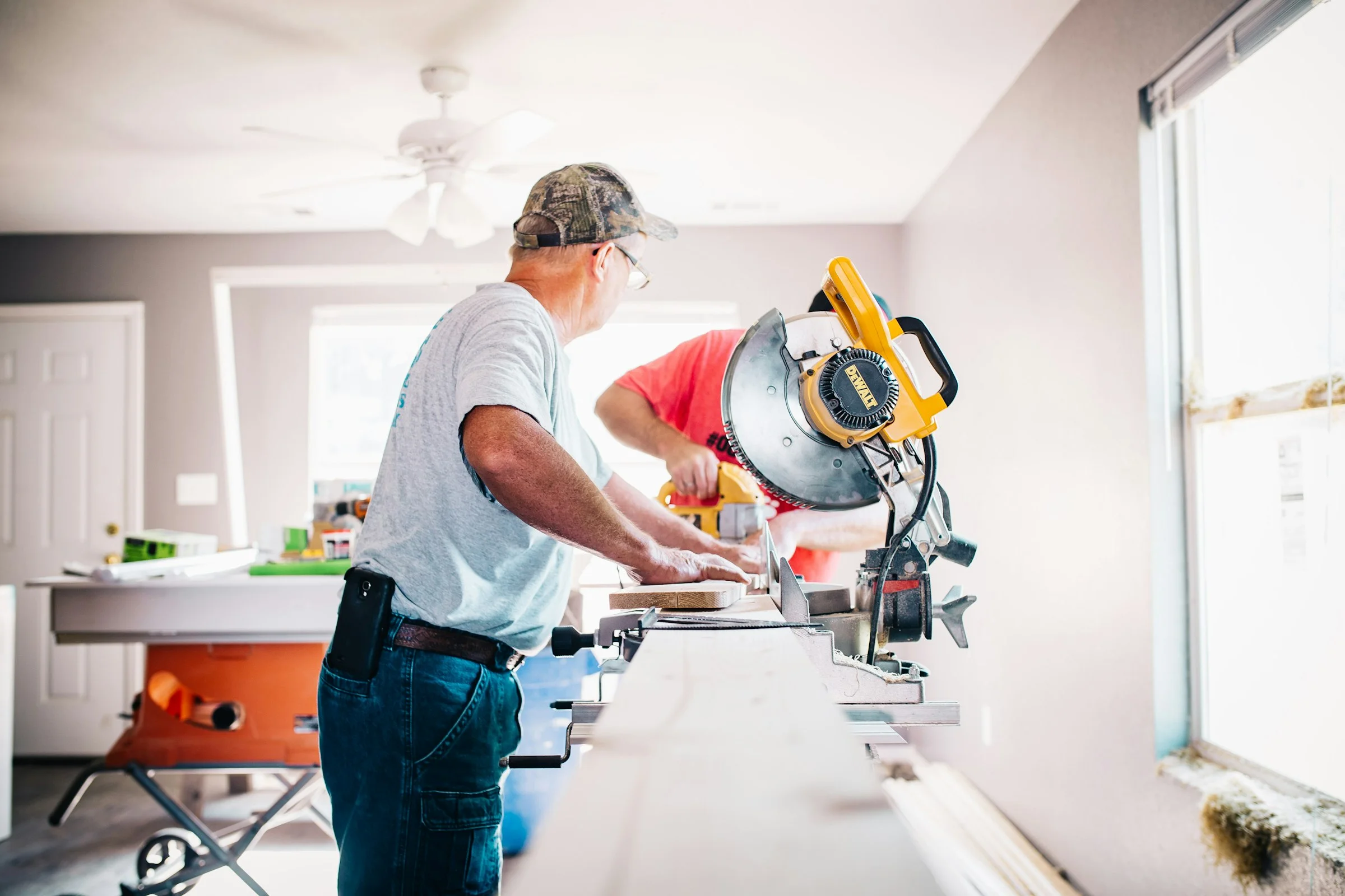Person drilling wood in a workshop