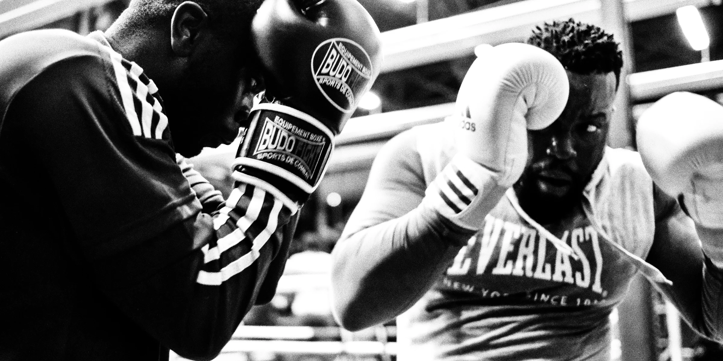 two men wearing boxing gloves.
