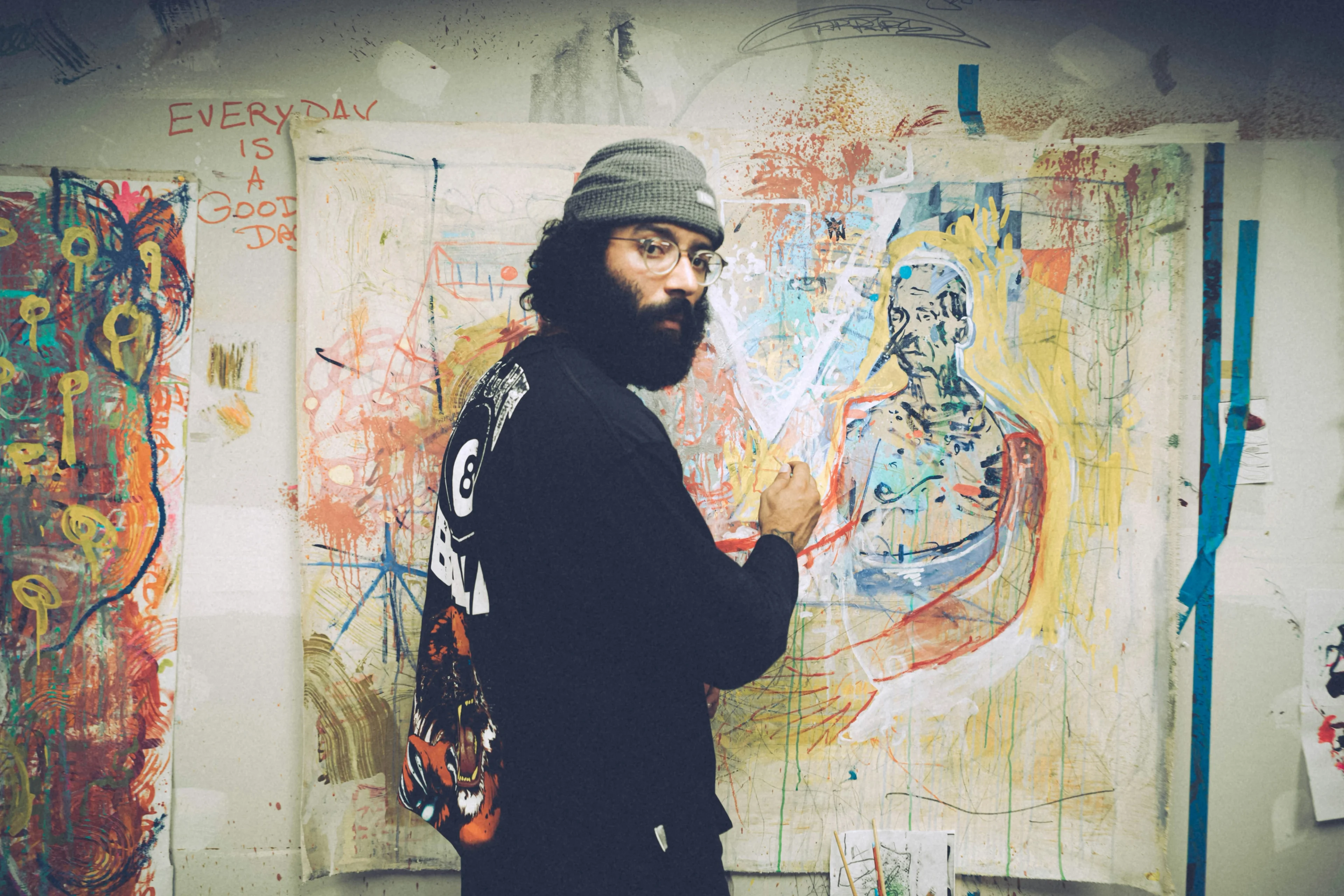 painter in front of his painting
